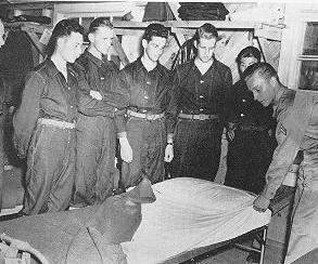 Trainees instructed on making a bunk
